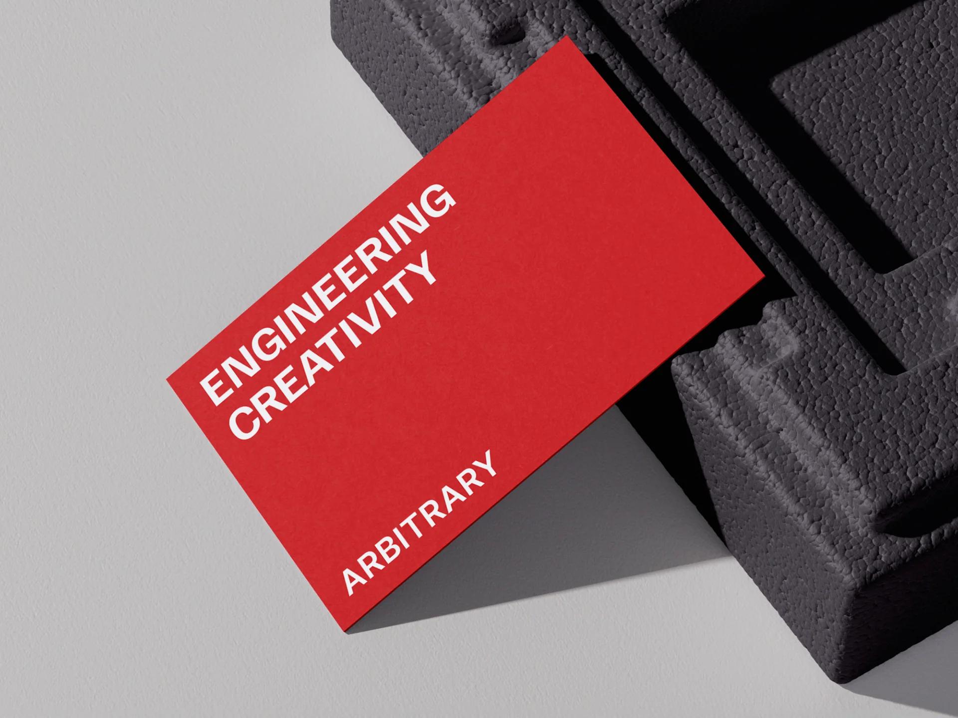 Red Arbitrary Engineering Creativity cards on dark fabric