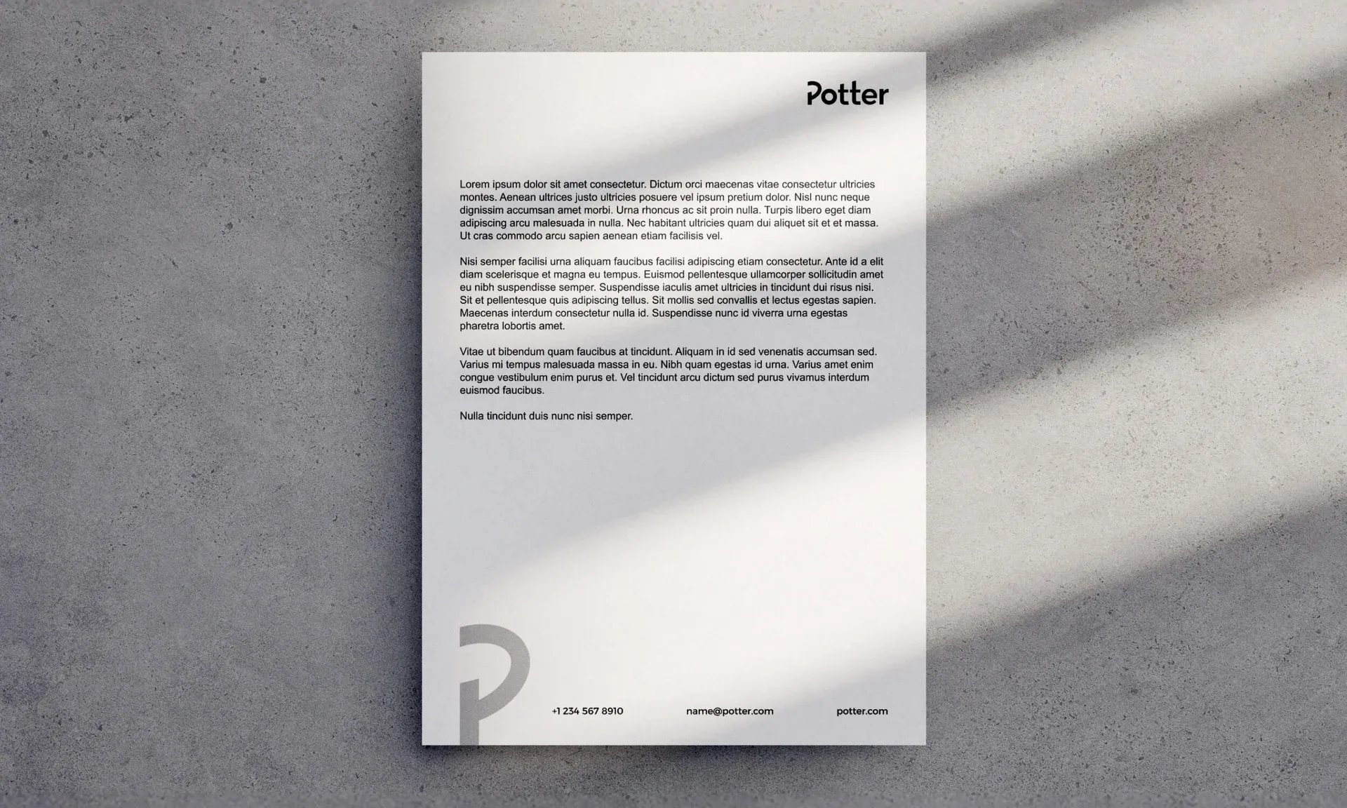 Potter Built letterhead on a concrete surface