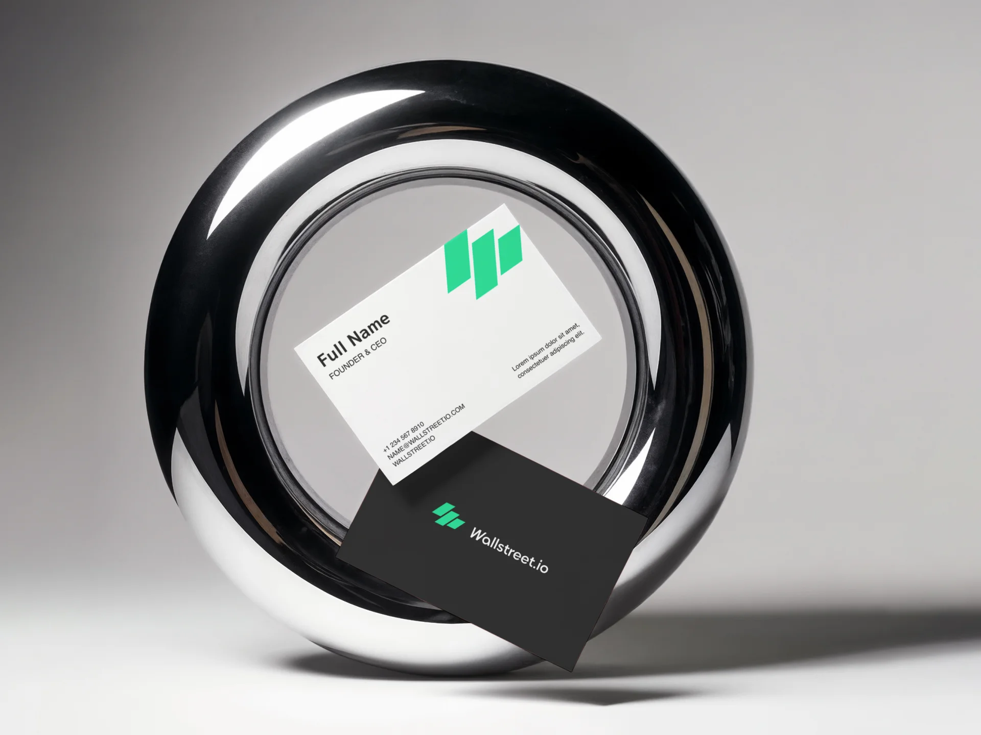 Wallstreet.io black and white business cards displayed on a metal ring